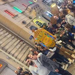 A Christmas procession & passersby who were local also sang along.