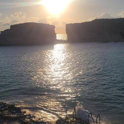 Sun beginning to set on tiny island of Comino.