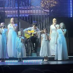 Jacob, the guy playing guitar, is the drummer, and son of Marty Hughes, the oldest brother.