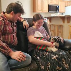 Tia opening her stocking. She got bacon.