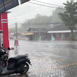 Another rainstorm. Shelter under the food mart lean to!