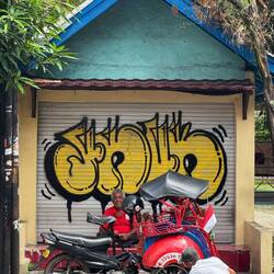 We saw lots of becak riders across central Jogja: here his becak is getting some tlc.