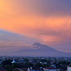 Mount Merapi, known as the "Mountain of Fire," defines Jogja's skyline