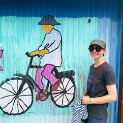 11. Amanda by a wall mural in Kotagede neighbourhood