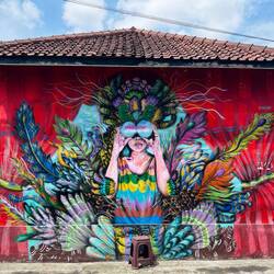 20. A child with a headdress is keeping an eye on us