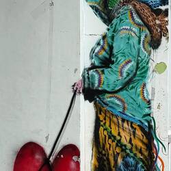 18. The figure with a heart on a string