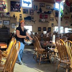 One of the waitresses throwing rolls at Fall Creek Steakhouse