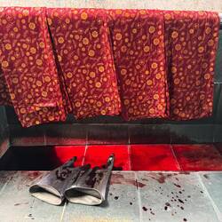 Dyed fabric with waxed pattern.