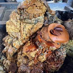 Used bees wax removed from patterned fabric. It can be used again to stamp fabric, but not in tulis