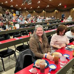 Rosanne at our table with our meal.
