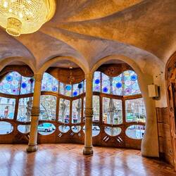 Curves and natural light highlight stained glass windows