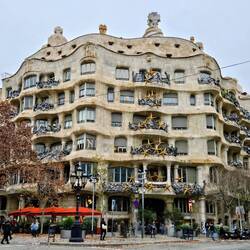 Outside of Casa Mila with XM decorations that obscure original design