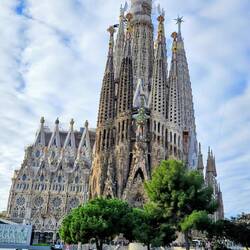 Sagrada Familia with a very green pond in the foreground