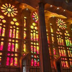 Otherworldly glow from sun streaming through stained glass