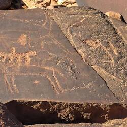 Probably a lion on the back of an antilope