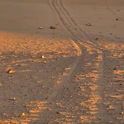 We decide to drive DOWN this steep slope into the structure.