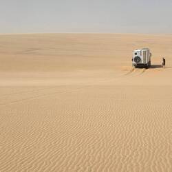 Tomm has got stuck. All men to the rescue with shovels and sand rails