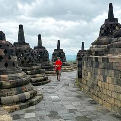 The small stone stupas each contain a statue of Buddha