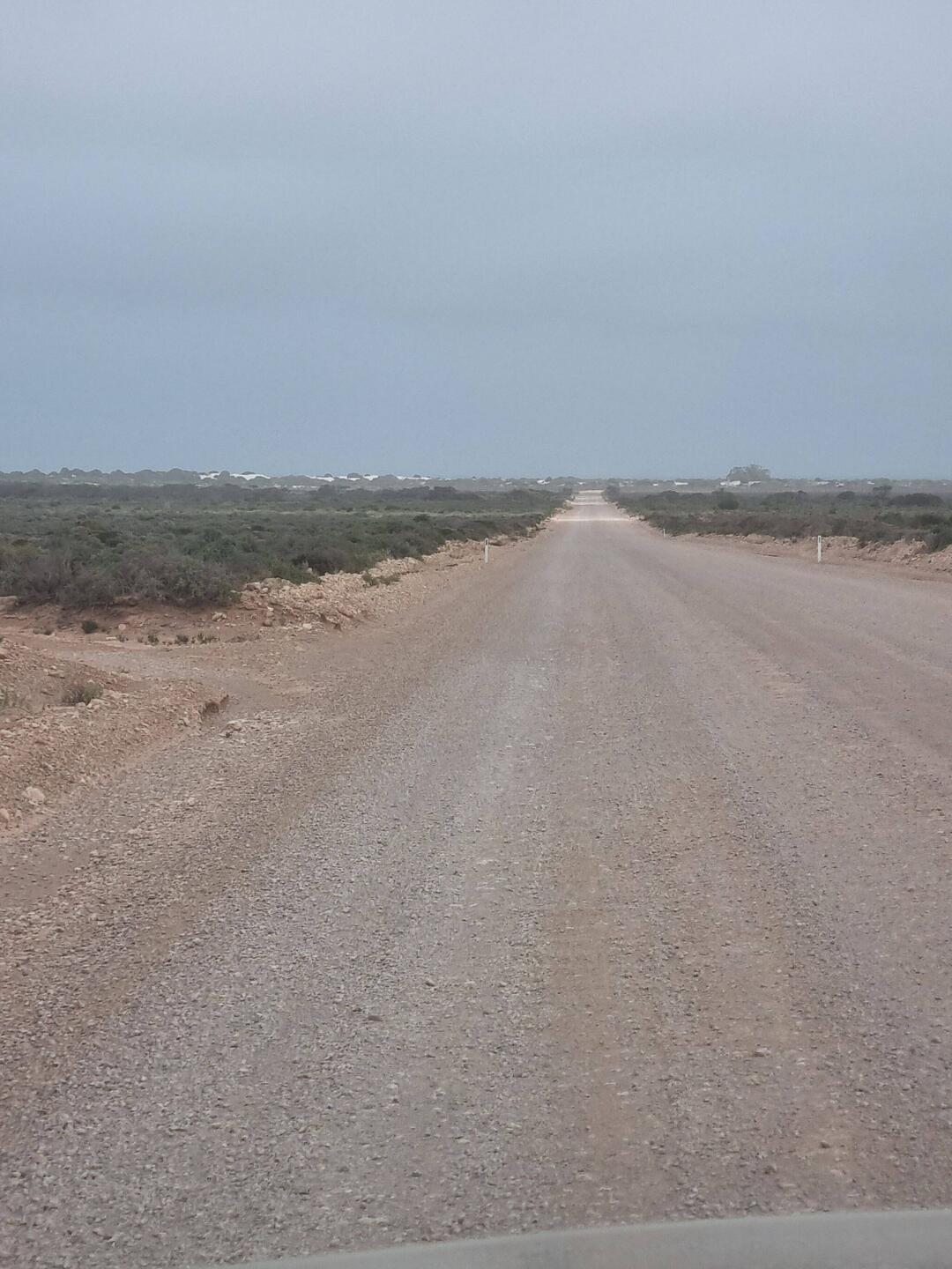 Road out to ruins, kept in good repair as the airport is behind the roadhouse.
