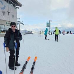 The husband getting ready to lock in the skis