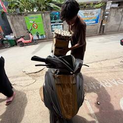 Innovation IRL. Off he went loaded with a 20lt bucket, carton of coke & all this on his old bike