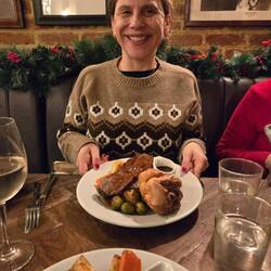 Abby with some type of cow organ on the plate