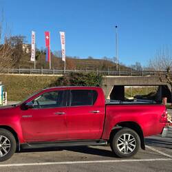 Rahel, Lucica (my mother) and our out of the ordinary red Toyota Hilux.