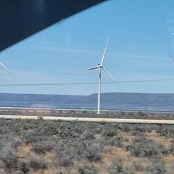 Wind turbines with solar panels underneath