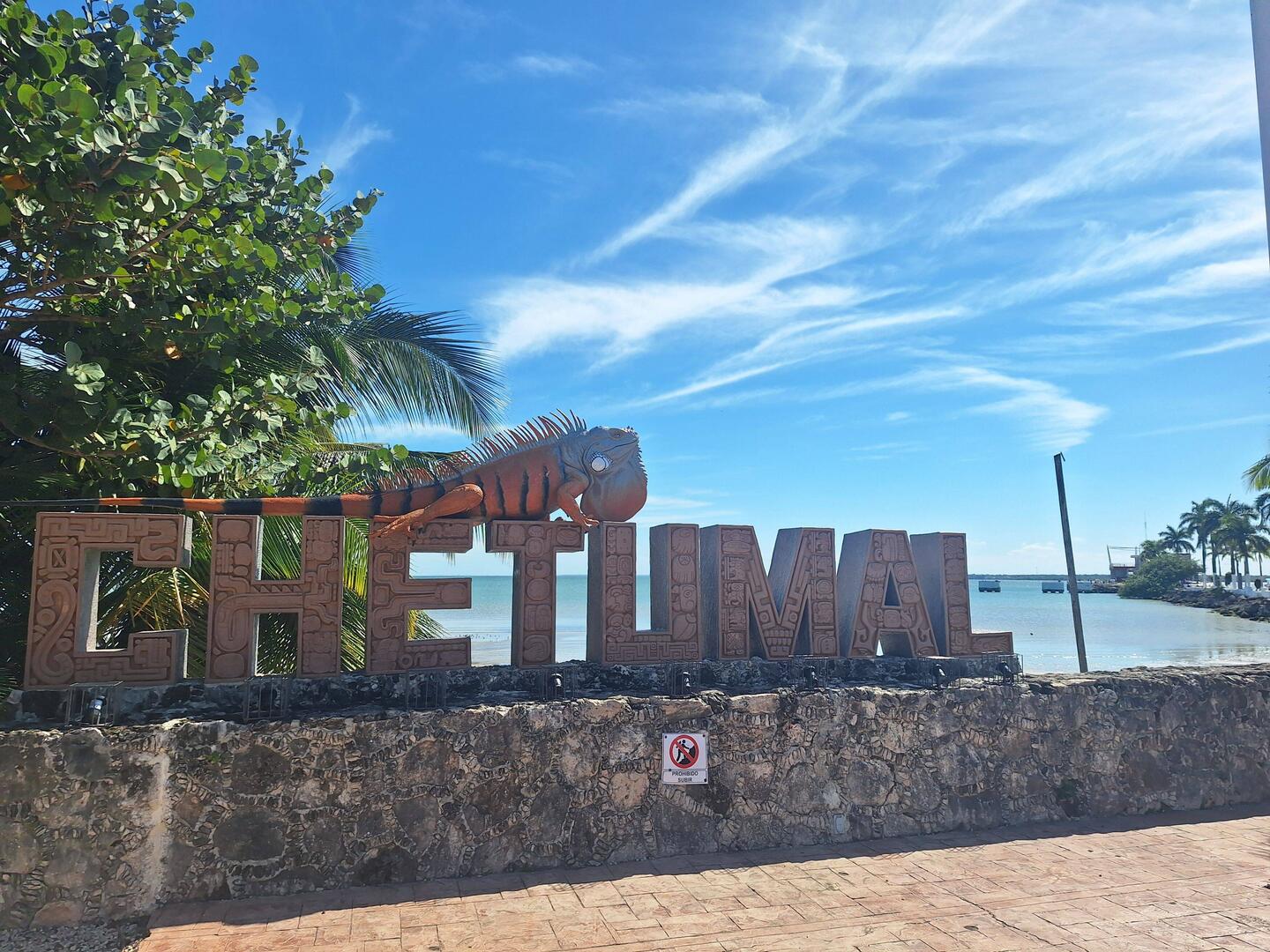 Iguana statue and letters by the ferry port