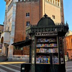 The baptistery and an antique newsstand.