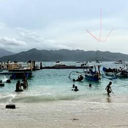 Local kids enjoying the water near the pier at Gili Air