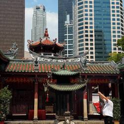 A man pays tribute at the temple