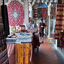 Bright patterned textiles and carpets of Kampong Glam