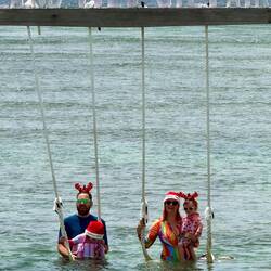 The Cmas hats look a bit out of place, but this family will have a great holiday memory