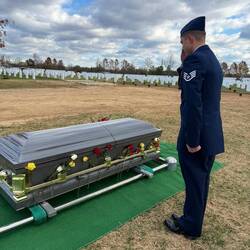Dan saluting Pawpa's casket