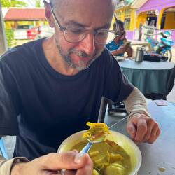 Lilz enjoys Malaysia's national dish: nasi lemak, on the house!