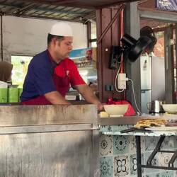 Making roti canai, a sight we would become very familiar with and that would become a beloved staple