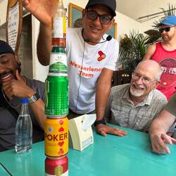 Local pub stacking Colombian beers—casual and social.