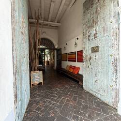 Once-ruined colonial buildings restored into hotels during Cartagena’s early-2000s revival.