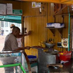 Fried plantains with cheese—hot, salty-sweet, and classic Cartagena cheap eats.