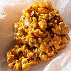Millet popcorn candy—crunchy, lightly sweet, and old-school Cartagena street candy.