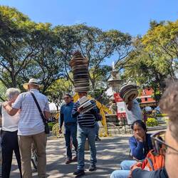 Vendor with stacked hats