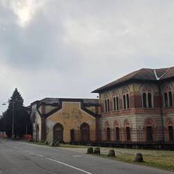 The workers' houses (left) in the mist. Crespi d'Adda.
