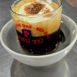 Look, a little dish of warm water to keep coffee hot!