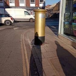 Teddington, Mo Farrah's gold postbox, painted to commemorate British 2012 Olympic gold medallists