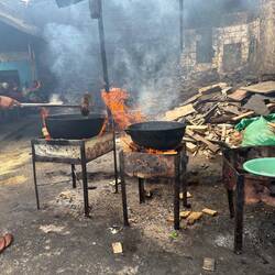Fire pits used for cooking meat for local vendors and families.