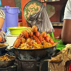 Rice with lobster prepared fresh and sold in the market.