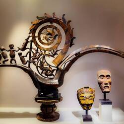 Stool from the Congo; masks from Indonesia ... Musée Barbier-Mueller — Geneva, Switzerland.