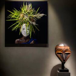 Small mask (Congo) paired with JP Huynh's "Flower Children Portrait 96" — Musée Barbier-Mueller.