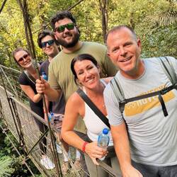 Getting closer! Look at us all smiles on an old hanging bridge.